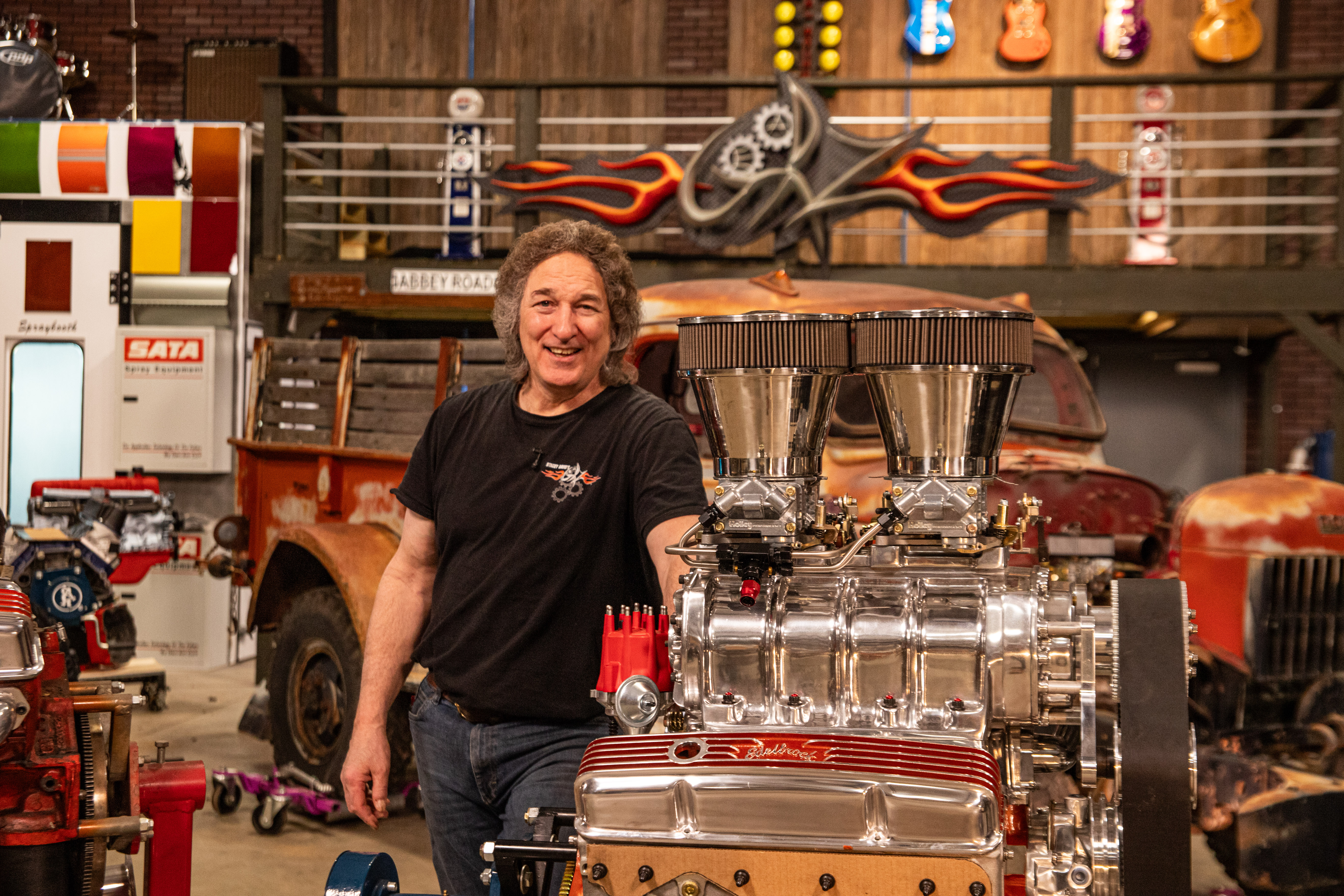 Stacey beside blown small block for Apache