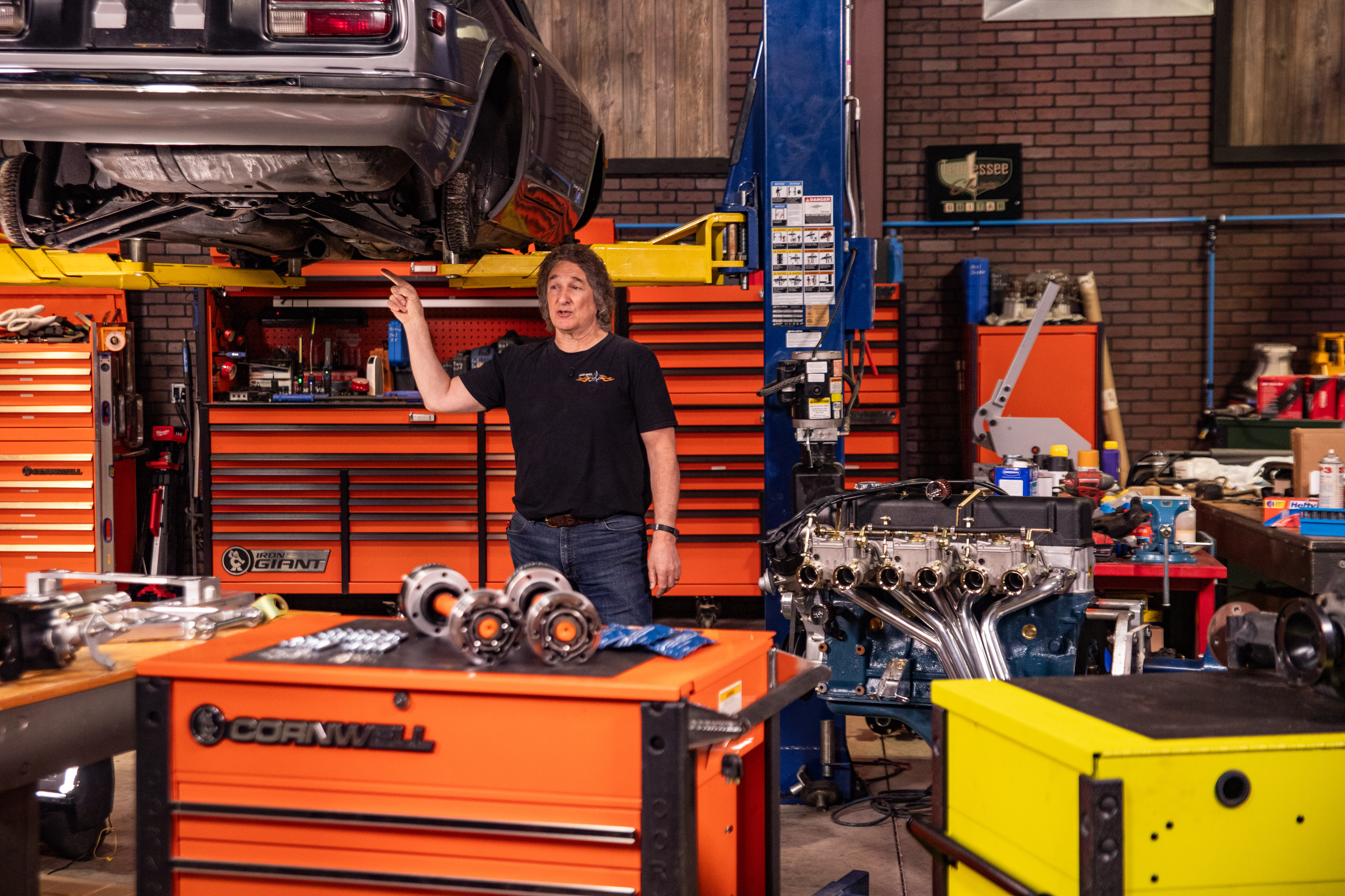 Stacey works on the 240z suspension