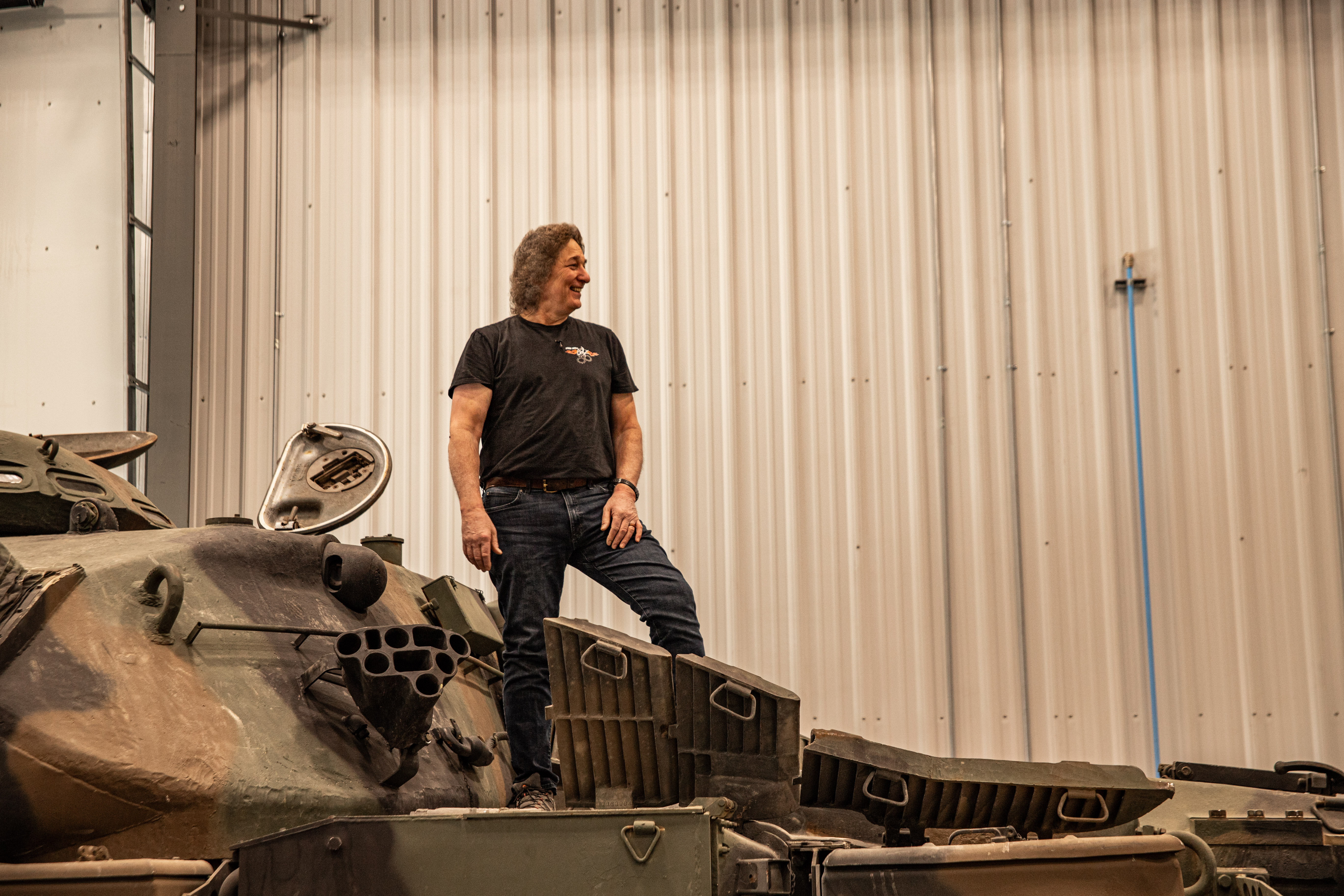 Stacey standing on a tank