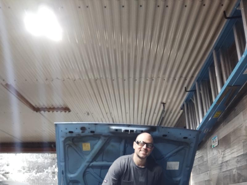 Adam standing in engine bay