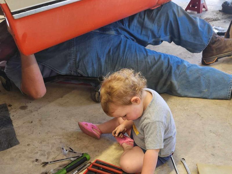 Daughter helping work on the truck