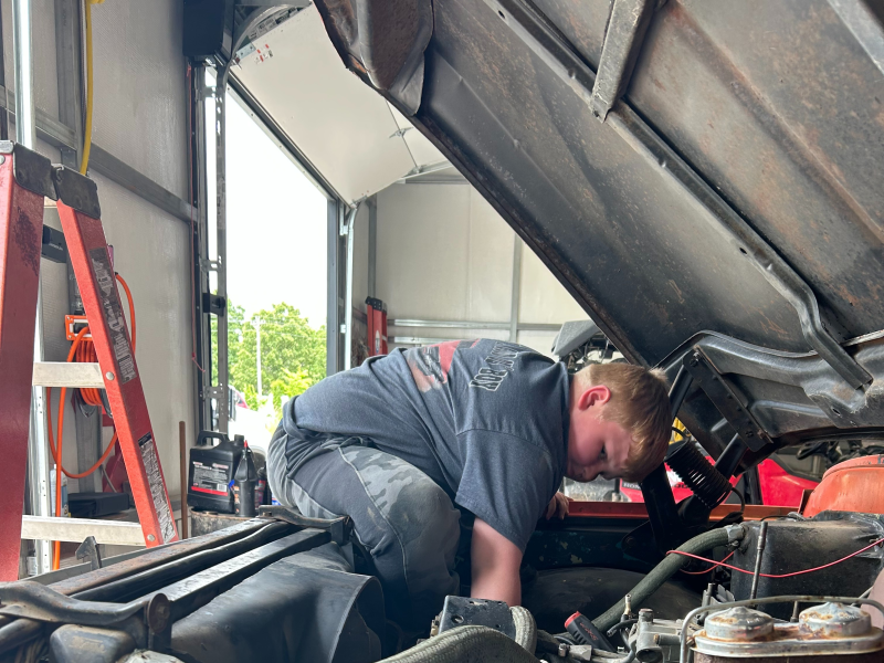 Nephew helping work on the truck